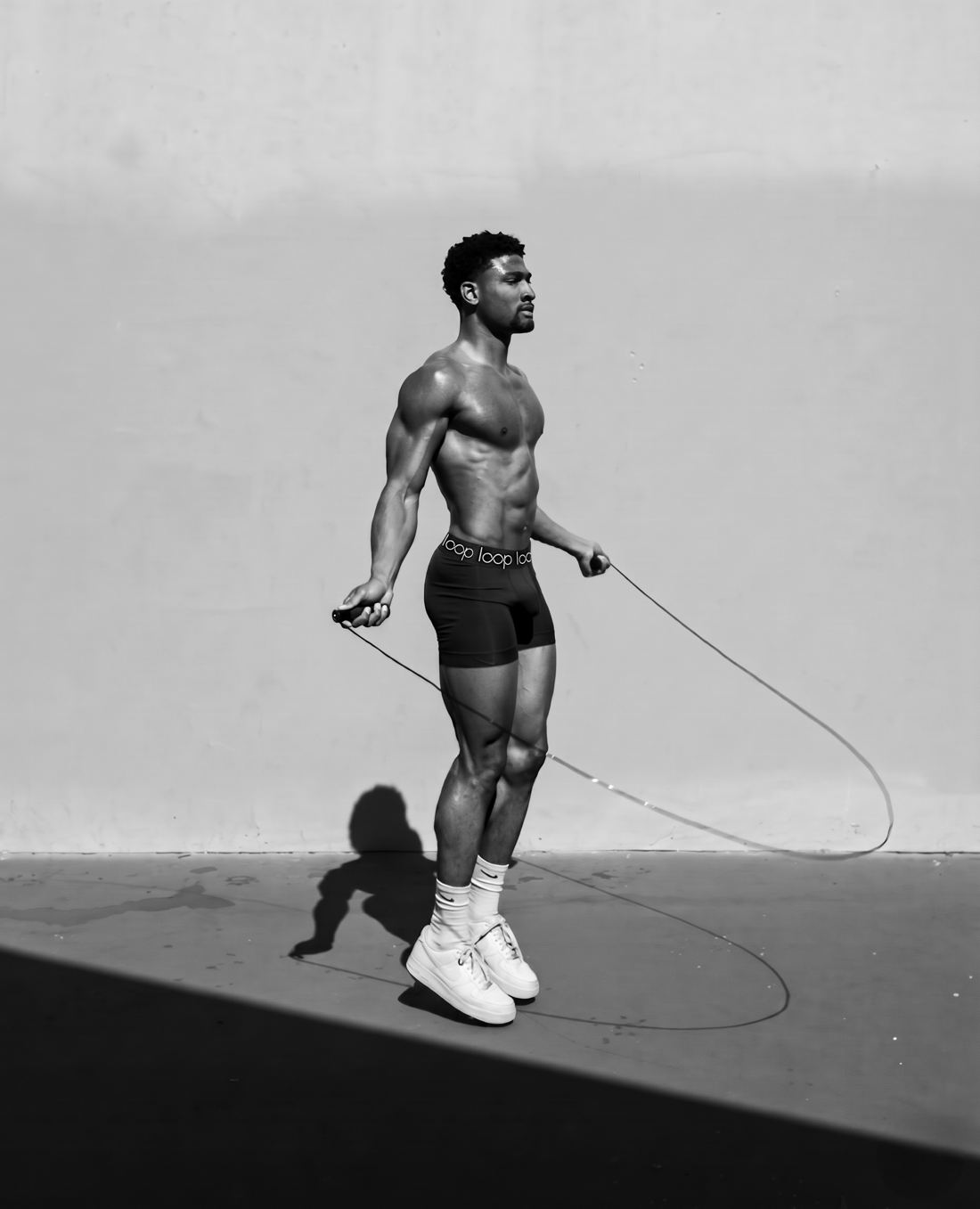 Athlete skipping rope in Loop boxer briefs with repeat logo waistband