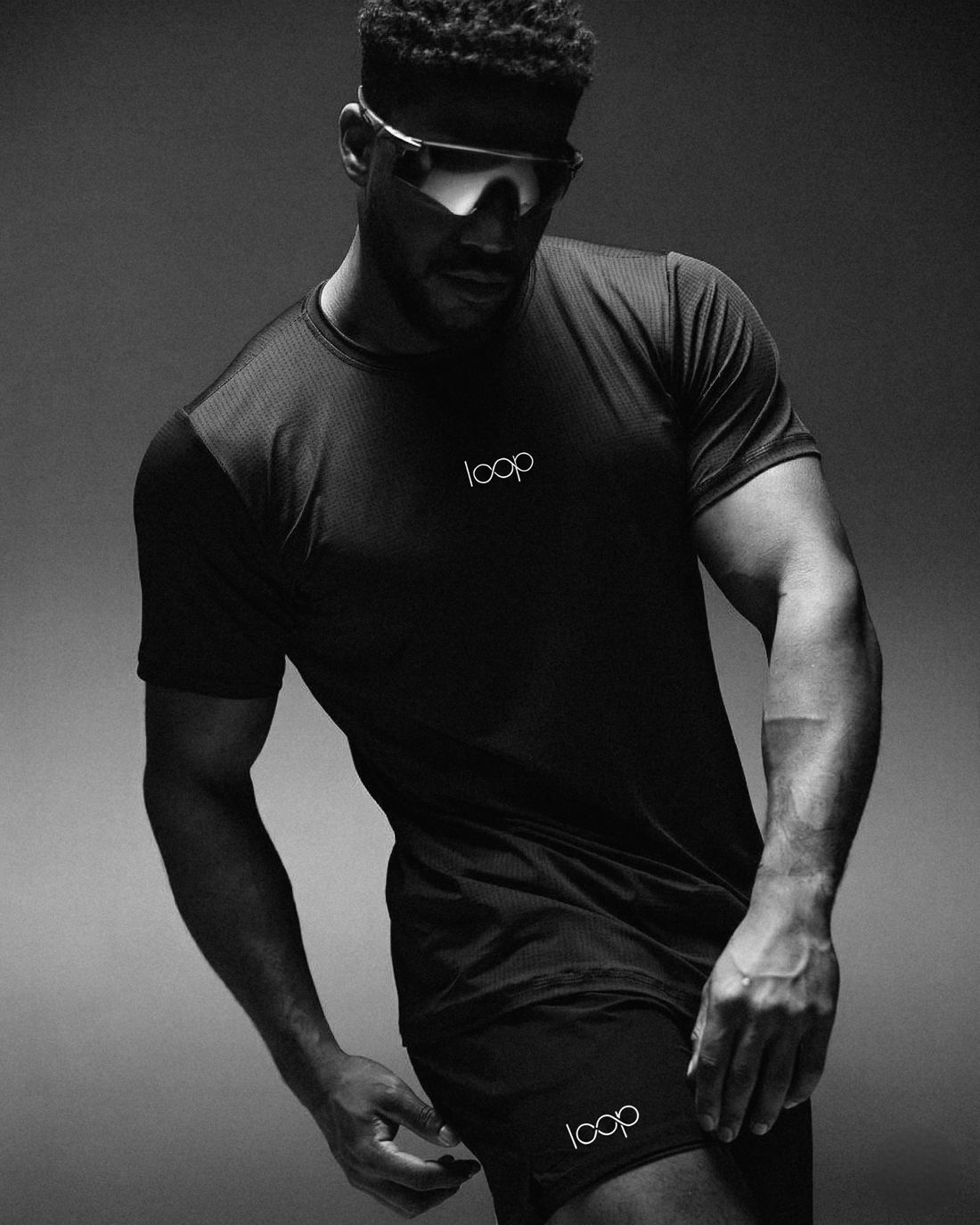 Athlete in a black Loop tee and shield visor