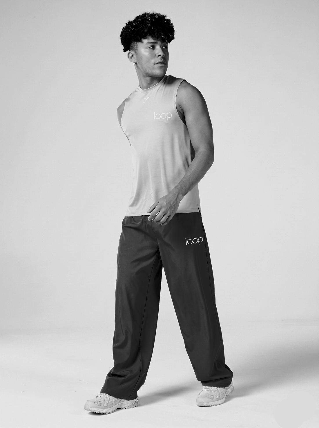 Athlete in a grey tank and wide black Loop trousers